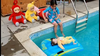 Teletubbies having fun in the Swimming pool
