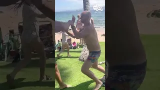 Congressional candidate Kirill Basin is knocked out by beachgoer after issuing threats to others.